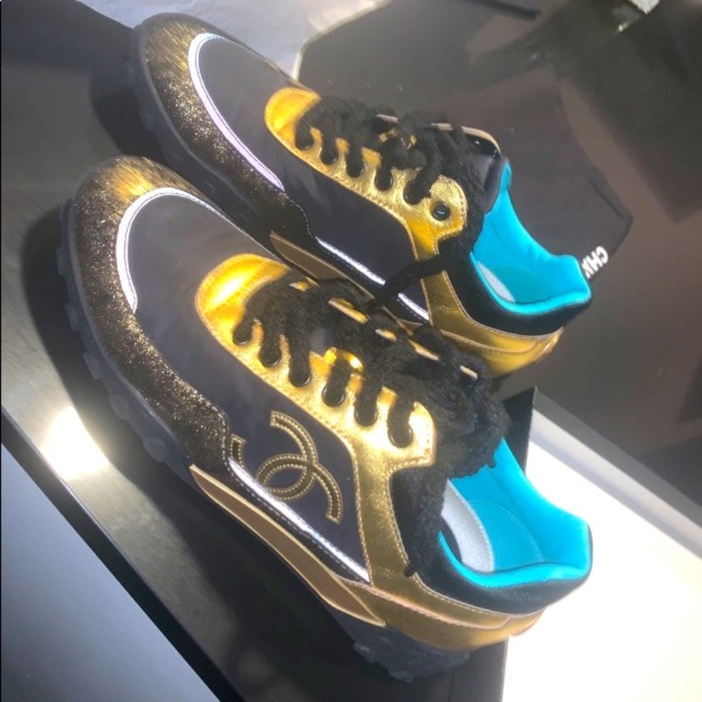 Gold and black Chanel sneaker